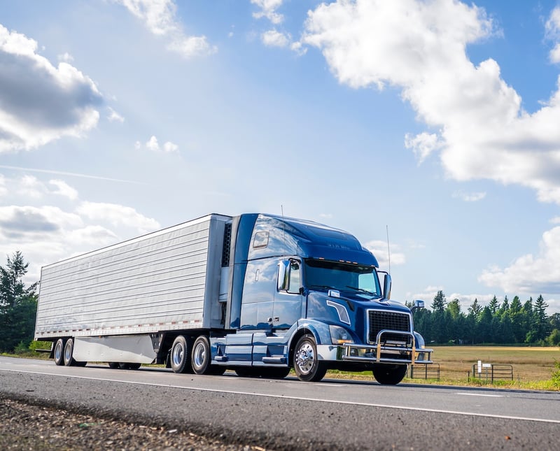 Blue truck on the road