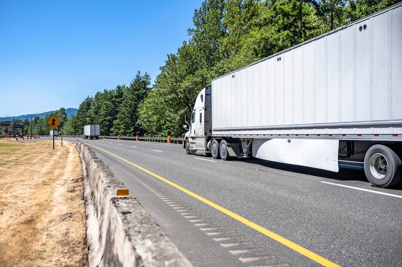 White truck driving on the highway