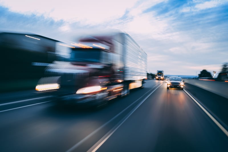 Semi truck on highway motion blur