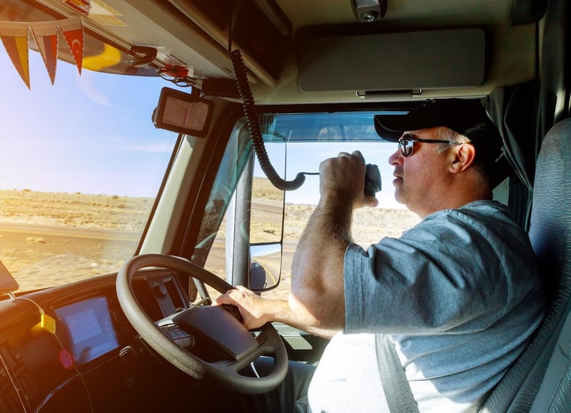 Truck driver using the radio
