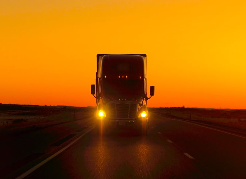 semi truck driving at night