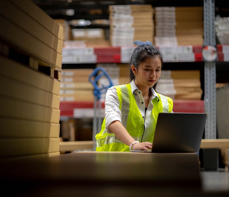 Staff Check stock details on tablet computer