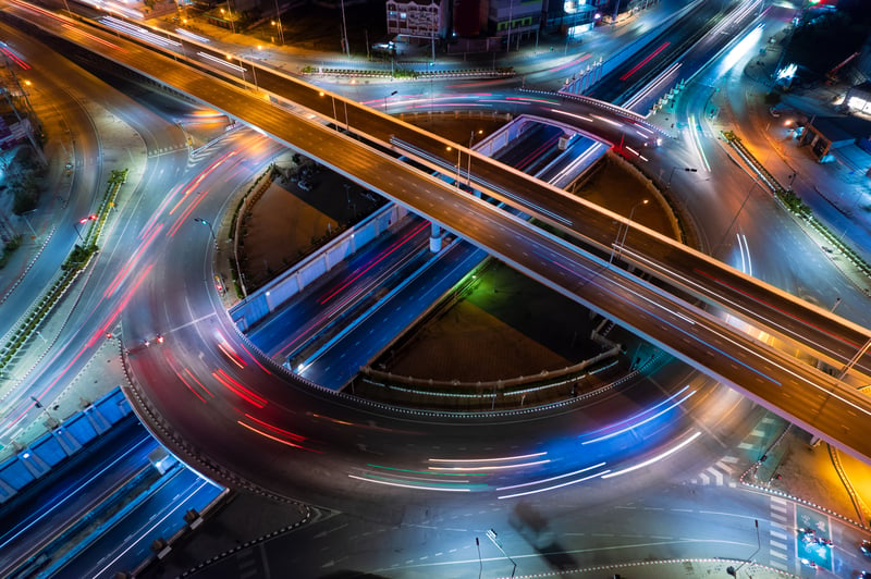 Aerial view of car traffic transportation above circle roundabout road