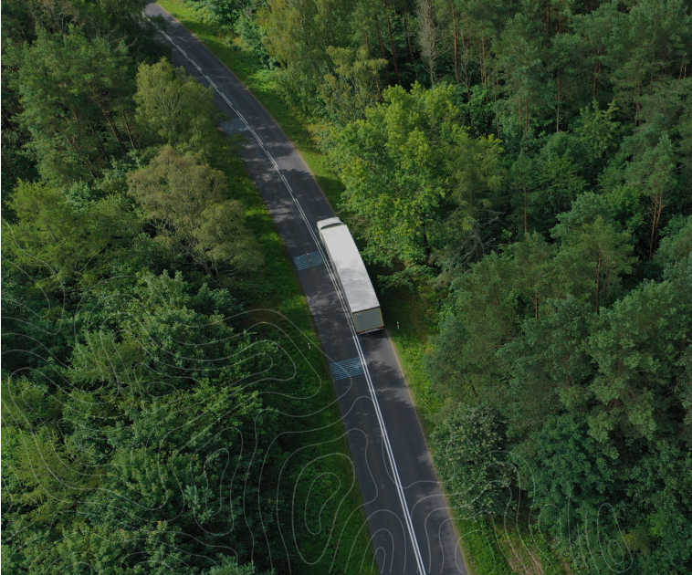 aerial view of truck on the road in the country roads