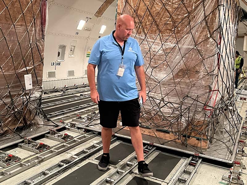 AirFreight.com employee inside cargo hold