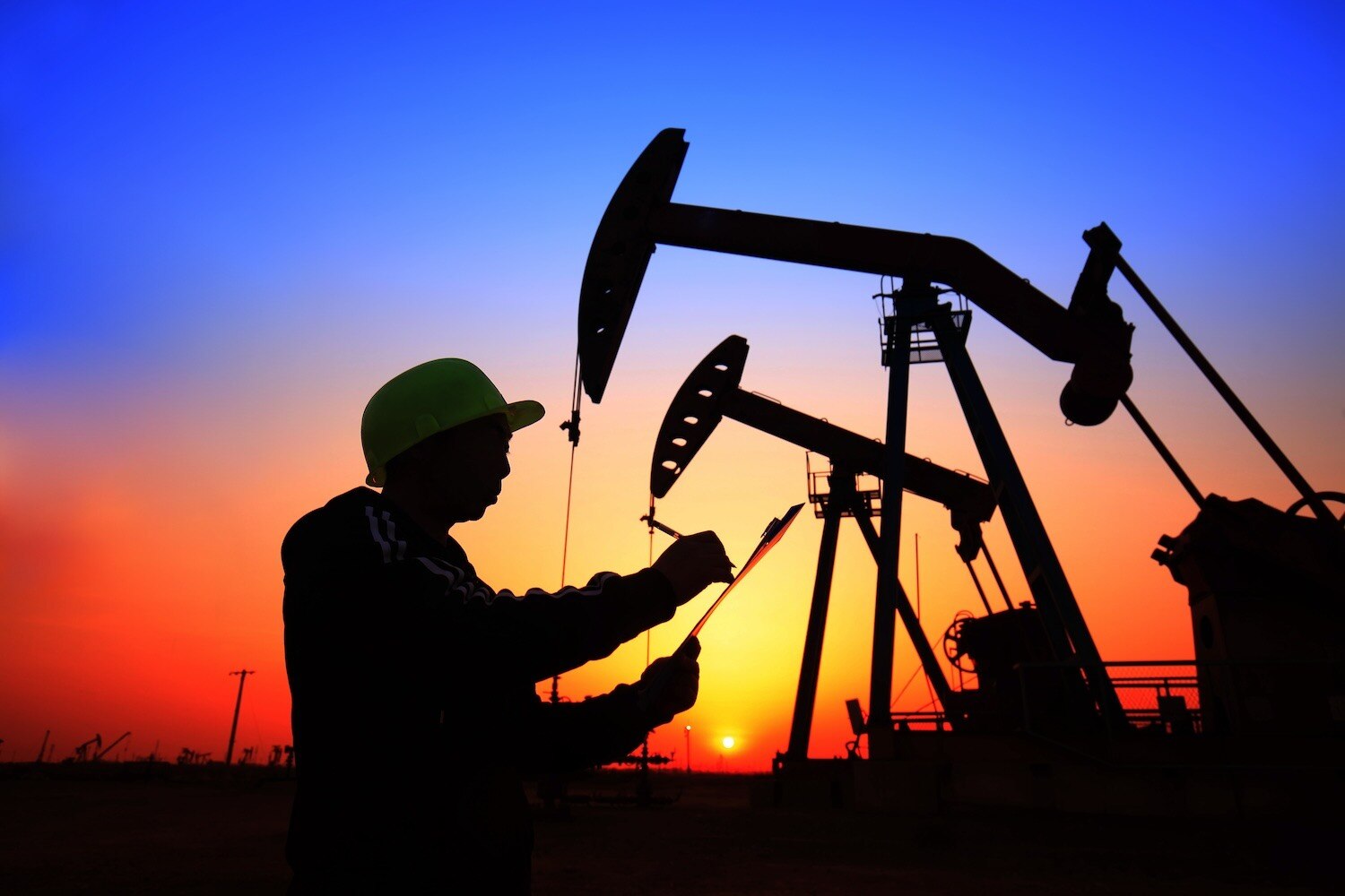 Oil worker with clipboard