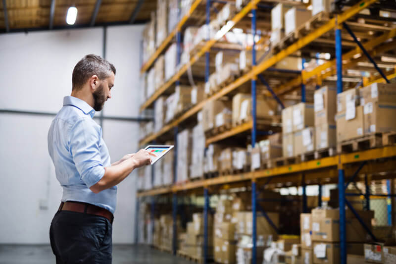 man holding tablet in warehouse