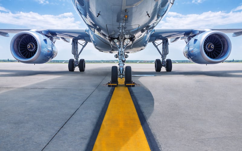 bottom view of airplane on runway