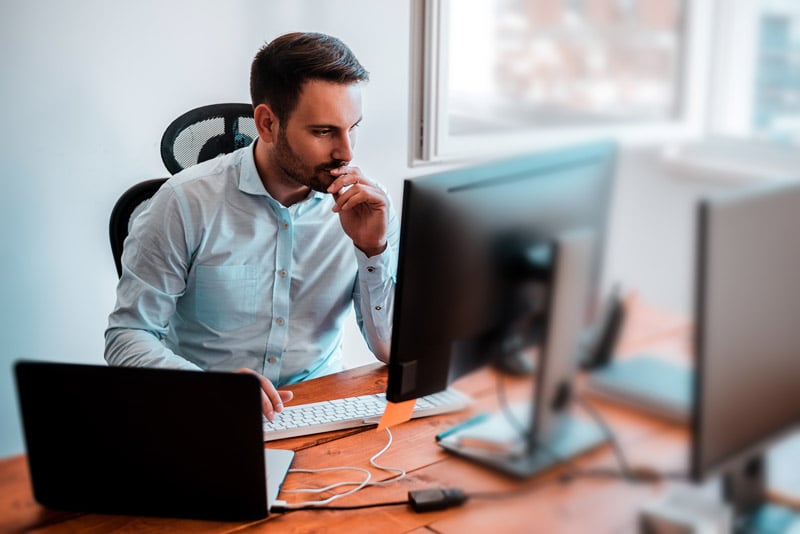 man working on computer in office