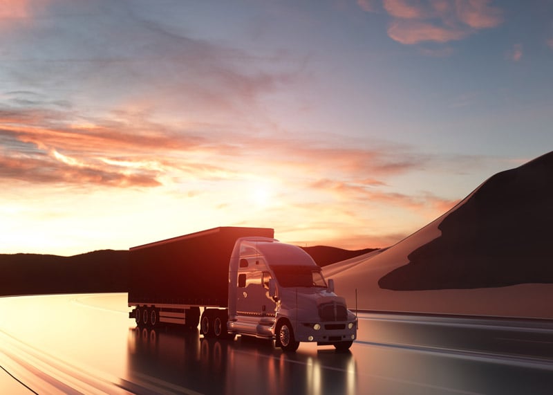 truck on the road during sunset