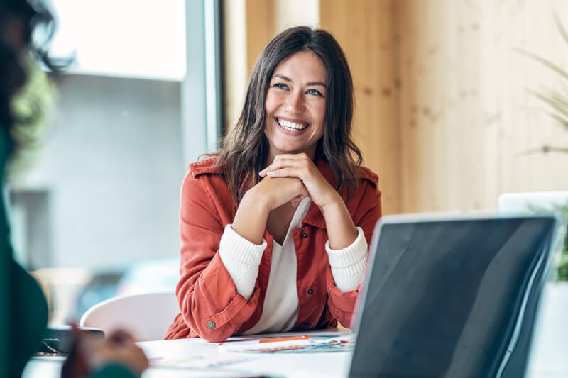 smiling woman in conference room