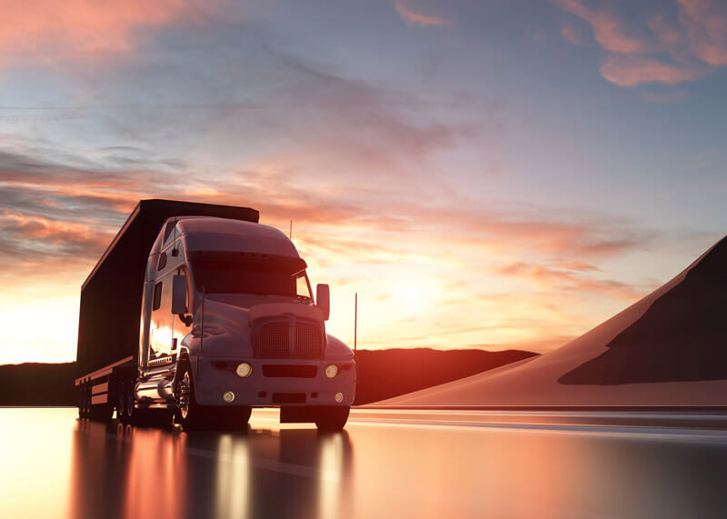 truck on the road at sunset